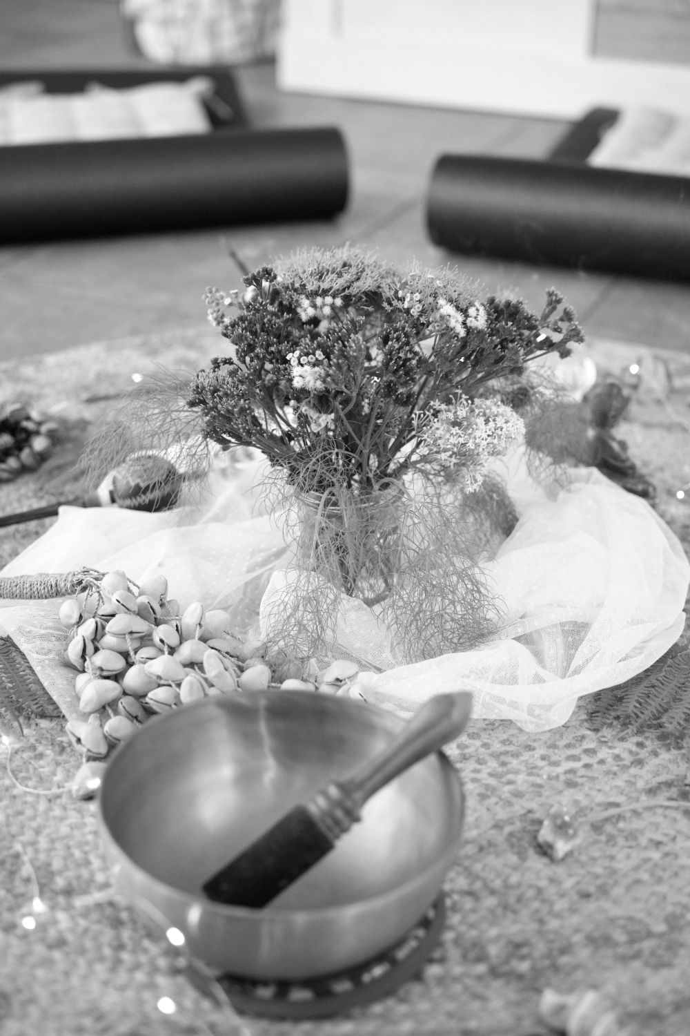 Flowers and a singing bowl prepared for a circle